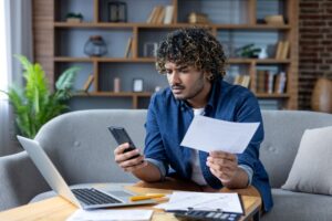 person looking at bills