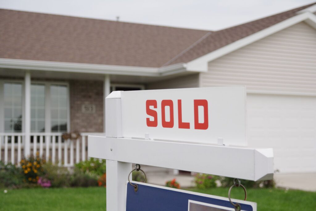 sold sign in front of house